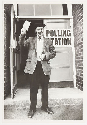 The photograph shows 98-year-old Allan Bagot about to cast his vote at Collingwood School in Bushbury, 1984