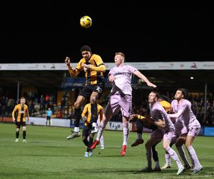 Sam Clucas goes up for a header with Cambridge United's Mamadou Jobe (Picture: Ben Phillips)