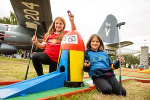 Visitors can enjoy mini golf beneath aircraft wings. Picture: RAF Museum.