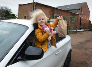 Sasha-Lea Cartright, of Stafford, with her food looking at the farm animals