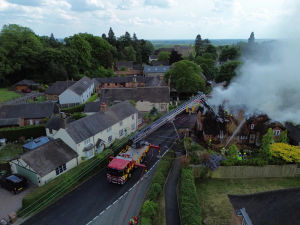 Firefighters extinguish large house fire in Swynnerton