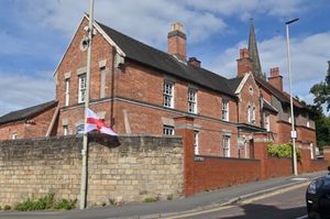 DUDLEY COPYRIGHT NATIONAL WORLD STEVE LEATH 21/08/25 A flags next to the former police station in Sedgley, now flats.