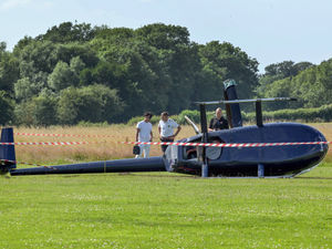 Supporting image for story: Pilot has lucky escape after helicopter rolls onto its side at Wolverhampton Airport