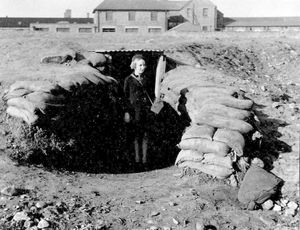 Sylvia at the entrance to an air raid shelter. Can anybody pinpoint the location?