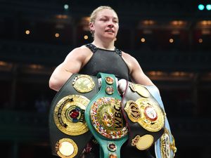 Lauren Price celebrates victory against Natasha Jonas