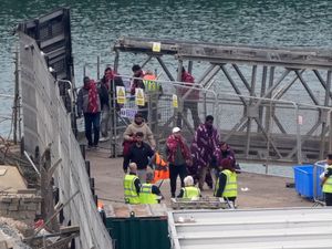 People coming off a Border Force vessel