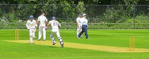 Whitchurch batters Maz Hasnain (long sleeve) and Yaqoob Yousef (Short Sleeve) and Hawks bowler Kursiad.