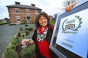 Pamela Morris owner of Willington Lodge with her Certificate of Excellence from TripAdvisor