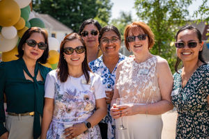 Chief Executive Debbie Price with Coverage Care staff enjoying the celebrations