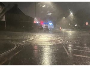 Supporting image for story: 'Every time it rains there’s a problem': 'Cracked' manhole bursts and floods busy Black Country road after heavy downpour