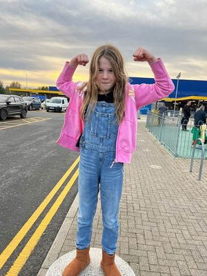 Evelyn, nine, who will have all her long hair shaved off for charity.