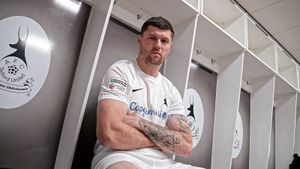 AFC Telford United striker Matty Stenson posing in their new all white home strip.