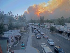 Supporting image for story: Cool weather could corral blazes that made thousands flee New Mexico village