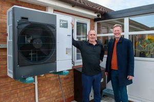 A GSA customer in Walsall proudly shows off their air source heat pump installed as part of the Matrix Decarbonisation Project. 
