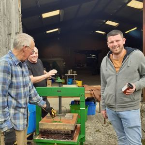 From left Glynn Roberts, Pete Harman and Mayor of Bishop's Castle Josh Dickin ready for pressing