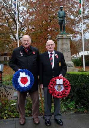 Jeff Thomas who laid a wreath for the Royal Air Force and Llandrindod Wells Royal British Legion Branch President Brian Jones wait for the parade to arrive at the Cenotaph. (Image: Andy Compton)