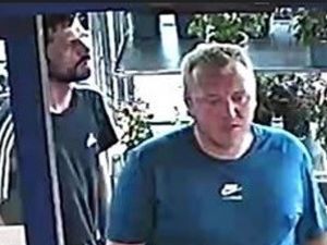 Do you know these two men? Police want to talk to them following a robbery in West Bromwich where staff members were threatened