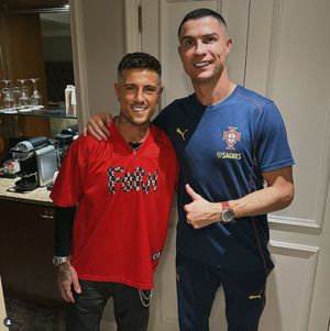 Cal Newsome with Cristiano Ronaldo after cutting his hair. Picture: Cal Newsome