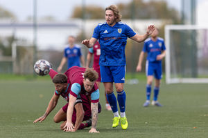 A battle for the ball in the clash at Telford College