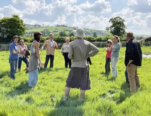 Councillor Jake Berriman (fourth left), Leader of Powys County Council, visiting the Sarn Farms project near Newtown