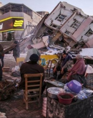 Members of Sefik's family in front of their collapsed apartment block