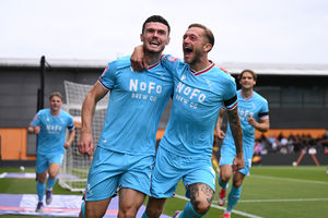 Connor Barrett celebrates his early opener for Walsall with Charlie Lakin. 