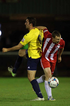 Andy Owens of AFC Telford United and Kevin Roberts of Brackley Town