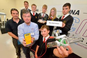 Overall Winners: Mary Webb School , Pontesbury. Front: Mentor: Andy Parhley from Western Power, Principal event Sponsor: DENSO and from them is: Phil Tomlinson, then student leader for the group: Marcelo Ortuno 15, back: Chris Thorley (teacher), Jack Jones 15, Pip Roberts 15, Ruby North 15, Ciaran Evans 15, with a device that uses mains water pipes and adds a generator to create power