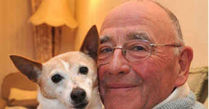 Thieves stole a pensioner's car containing his beloved pet dog as the pensioner visited the grave of his late wife.