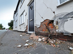 Supporting image for story: Police hunt continues for driver of cloned car who crashed into houses before running off