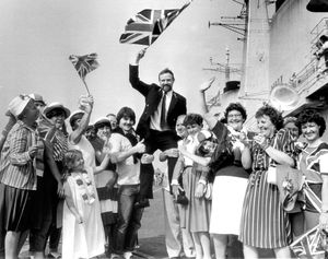Chief Stoker Dave Tisdale gets a lift from his family and friends who traveled from West Bromwich and Walsall to welcome him home from the Falklands at Portsmouth in 1982.