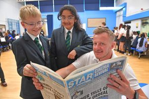 Wrekin View Primary School's Deputy head Paul Kilburn with pupils Riley Brown and Laura Senkerova at the careers fair