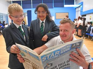 Wrekin View Primary School's Deputy head Paul Kilburn with pupils Riley Brown and Laura Senkerova at the careers fair