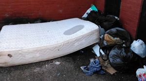 A mattress and black bin bags left at another site in the town