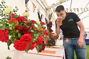 Young farmer John Lewis enjoys a pint