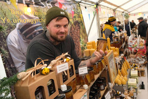 Tom Bottrill of Bee Welsh Honey was selling honey, chunk honey, beeswax wraps, candles and new product creamed honey. Image by Andy Compton
