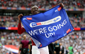 Albert Adomah celebrating promotion to the Premier League with Aston Villa in 2019.