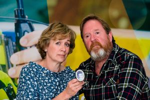 Beverley Brindley and Mark Brindley holding a photo of their son James when he was a baby, at Tuesday's press conference.
