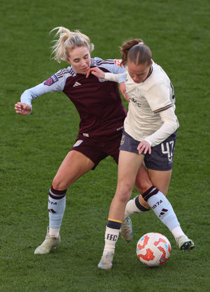 Everton's Karoline Olesen of Everton is challenged by Villa's Missy Bo Kearns (Photo by Morgan Harlow/Getty Images)