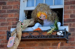 Rapunzel let down her straw hair from a window