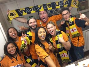 British expatriate Michael Long, from Tettenhall, holds up a scarf with his ‘Wolves family’