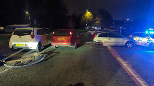 The collision involved two cars and saw a man and woman taken to hospital