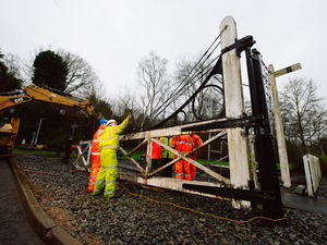 Supporting image for story: Historic Ironbridge railway crossing gates being restored 