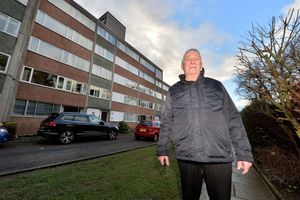 Dennis Clark outside Coton Manor. Where he is standing was covered in water