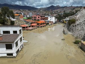 Homes are flooded by the overflowing Pasajahuira River in La Paz, Bolivia