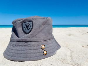Wherever I lay my hat – a Wolves hat positioned on a sunny beach