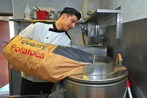 Mel at work at the family fryer