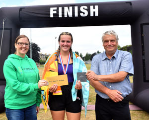 Winner in the female 19-49 category, 200m swim and 3k run - Ffion Price with Emma Coates from the Bracken Trustand Builth Wells Deputy Mayor Councillor Alan Waller. Image by Ted Edwards Photography