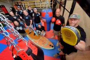 Ryan Whitehead, right with punch pad, and the Talking Men Telford group at Slammers