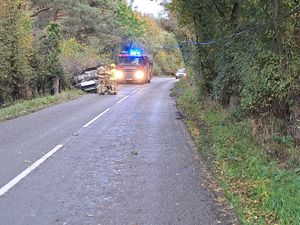 Supporting image for story: Emergency services and passing motorists help after car hits telegraph pole and flips on A488 in South Shropshire